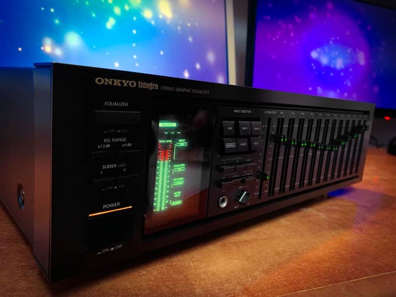 Black Onkyo Integra EQ-540 stereo equalizer with illuminated green level meters.