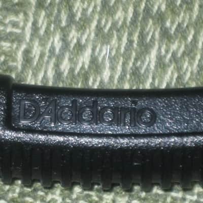 new (no package) very near A+ D'Addario Planet Waves PRO-WINDER Black String Winder & Cutter & Bridge Pin Puller DP0002 for guitar, mandolin, ukulele & banjos (black hard plastic with hardened steel wire cutters) just has few minor natural imperfections image 2