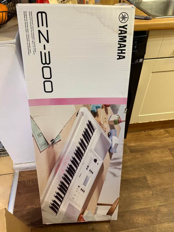 Yamaha EZ-300 61-Key Portable Keyboard with Light-Up Keys
