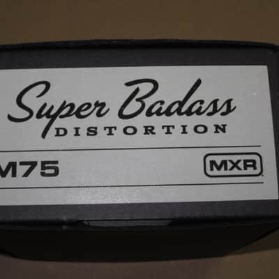 lightly handled - some imperfections MXR EMPTY BOX ONLY for M75 Super Badass Distortion (NO pedal / NO paperwork) specifically from 2015 (2010s - 2020s) - BOX: Black Cardboard / LABEL: Light Gray & Black/ GRAPHIC: Silver image 6