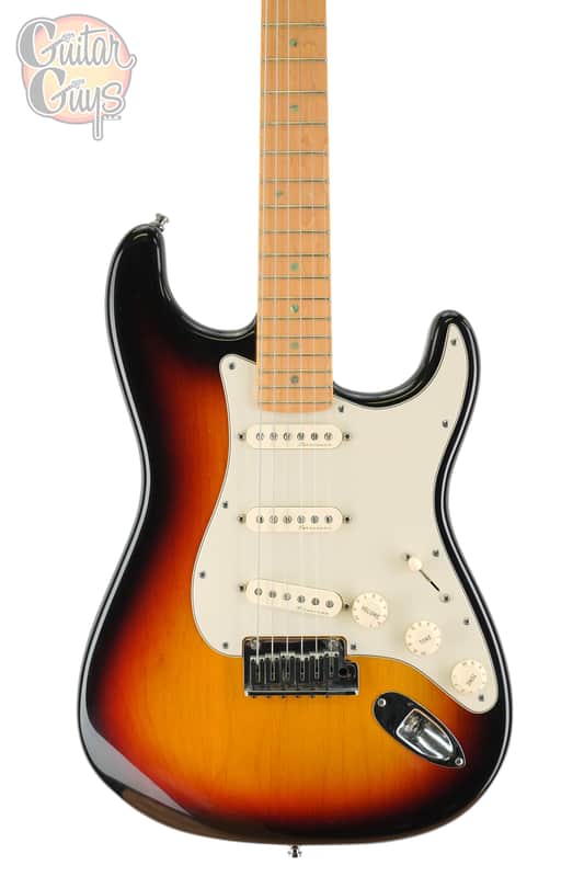 Black electric guitar in open black presentation case.