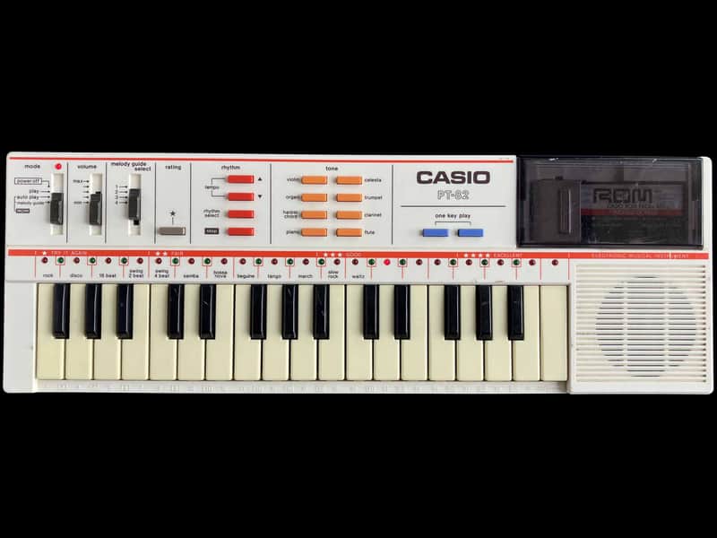 1986 Casio PT-82 32-Key Mini Portable Toy Keyboard w/ World Songs ROM Pack image 1