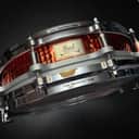 PEARL UK Ltd. 21st Anniversary Free-Floating Hammered Brass 14x3.5" Piccolo Snare Drum (2nd Gen) 2001 - Red Lacquer Over Brass