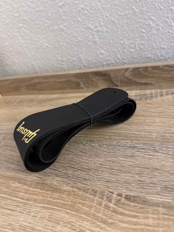 Gibson stock Guitar strap 2016 - Black - STILL HAS THE RUBBERBAND TIE ON IT image 1