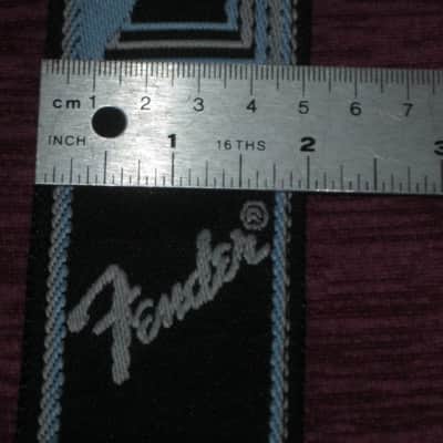 new with tags genuine Fender 2" Monogrammed Guitar Strap Black, Light Gray, and Light Blue - Fender part number: 099-0681-502, Fully adjustable length (39"-72") Woven Fender logo and guitar headstock design, polyester backing, black leather ends image 3