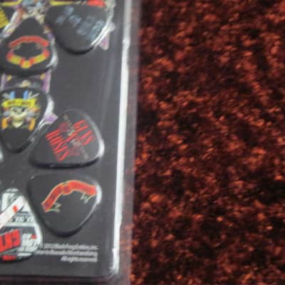new in package (old stock) A+ Perri's Leather Ltd. / Perri's 12 Pack Of Guns N Roses Guitar Picks - Med Gauge - Celluloid Plastic, 351 shape - but slightly curved (LP12-GNR1) LP12GNR1 image 18