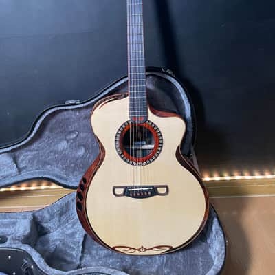 Merida Sadhu cutaway solid Spruce/ rosewood Acoustic guitar with hardcase image 1