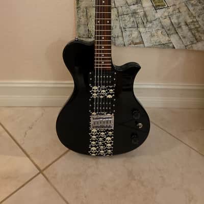 First Act ME543, Black with skulls, VG image 1