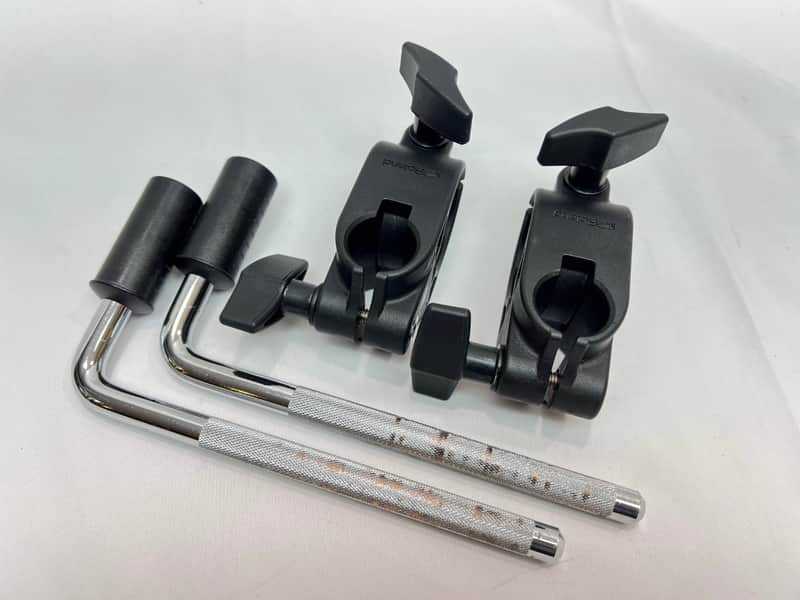 Three black and silver guitar strap locks with black grips on white surface.