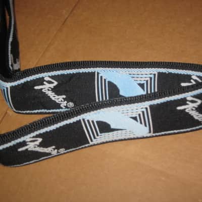 new with tags genuine Fender 2" Monogrammed Guitar Strap Black, Light Gray, and Light Blue - Fender part number: 099-0681-502, Fully adjustable length (39"-72") Woven Fender logo and guitar headstock design, polyester backing, black leather ends image 18