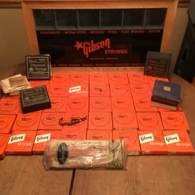 Gibson String Display case 1950's -60's orange and black full of unused strings image 1