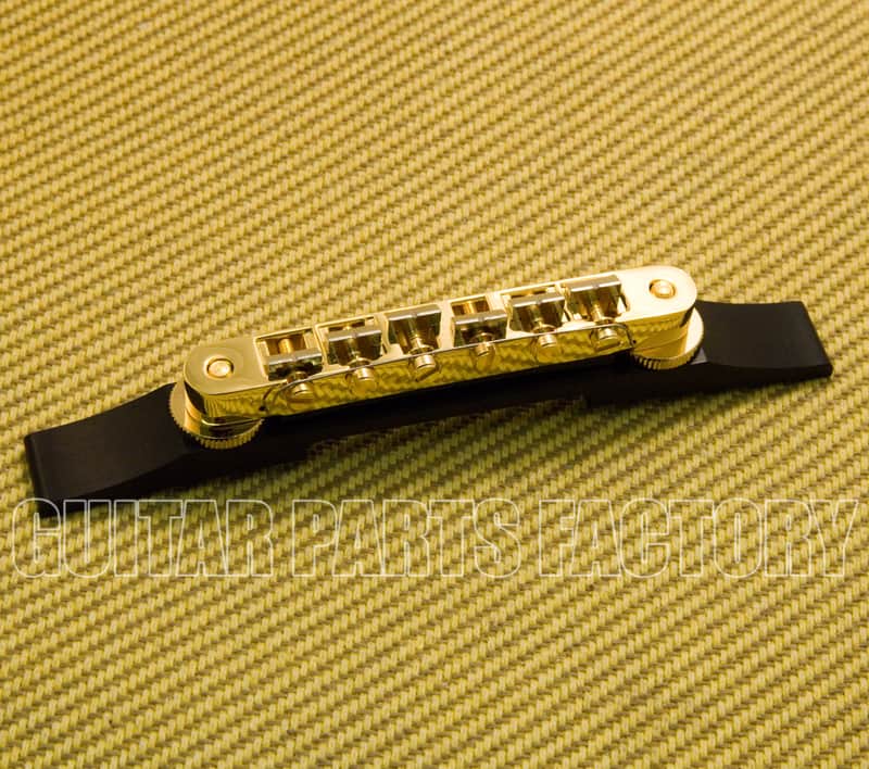 008-0628-049 Genuine Gretsch Gold Bridge Assembly A-O-M Ebony Base image 1