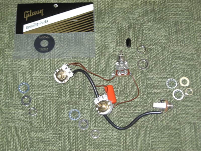 used 1997 Gibson control harness: 1 vol pot & 1 tone pot short shaft +nut/washer,wires,wire insualtion,capacitor,jack+nut/washer,switch +switch tip,nut +comes w/ new switch washer (NO other parts included) from The Hawk guitar (guitar NOT included) image 1