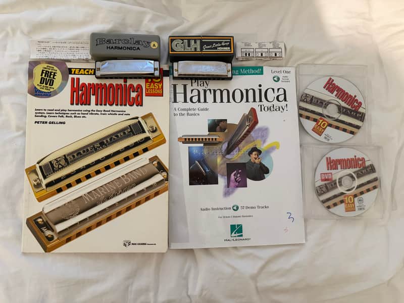 2 Harmonicas, 2 instruction books, and 2 CDs image 1
