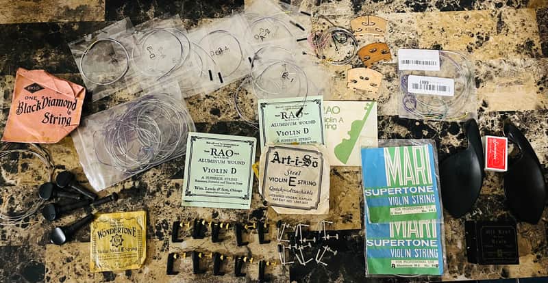 Violin fittings; bridges chin-rest, various brands of strings new and old. Project for luthier, pegs and other fittings. Sold as is. image 1