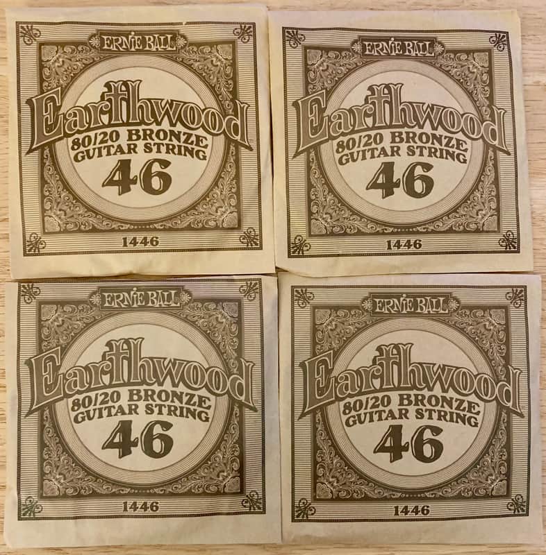 Four Single .046 Gauge Acoustic Guitar Strings (Ernie Ball) Opened, Not Played image 1