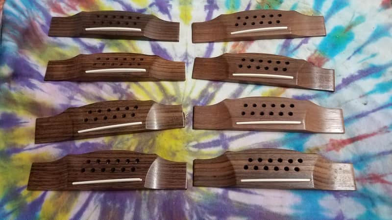 Quantity of 8 Rosewood 12 string bridges NOS image 1