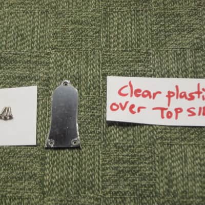 open package (near A+) unknown brand Epiphone 3 Hole Truss Rod Cover, blank (NO info), 2 ply (black front side / white bevelled edge, & white back side), bell shape + silver screws (TOP SIDE of cover has clear plastic over it), from 2020s image 1