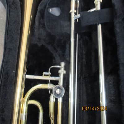 New Gold color trigger trombone. With case and mouthpiece. image 2