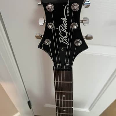 B.C. Rich Warlock Bronze Series with the aggressive Widow head stock image 2