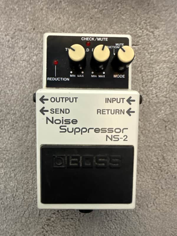 White and black electronic effects pedal with knobs and labeled controls.