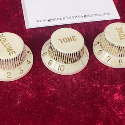 General Vintage Tone   60’s Stratocaster three spoke vintage knobs aged  white parchment old