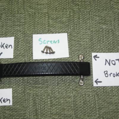 lite use (one mounting piece is broken) genuine Vox Black Plastic Dogbone Style Guitar Amplifier Handle with VOX logo and Diamond Pattern [Black hard - but flexible Plastic /  Metal Nickel mounting pieces (1 mounting piece is broken) + screws (from 2000) image 1