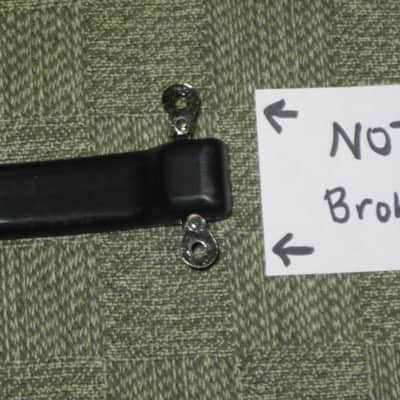 lite use (one mounting piece is broken) genuine Vox Black Plastic Dogbone Style Guitar Amplifier Handle with VOX logo and Diamond Pattern [Black hard - but flexible Plastic /  Metal Nickel mounting pieces (1 mounting piece is broken) + screws (from 2000) image 9