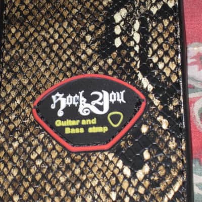 lite use RockYou (Rock You) PU Faux Leather Snakeskin Pattern Guitar Strap (front: brown, tan, black pattern) (back: black) reversible - main part of strap 2 & 3/4" wide, belt part 1 & 1/4" wide [polyurethane leather] Adjustable Length from 44" to 53" image 3