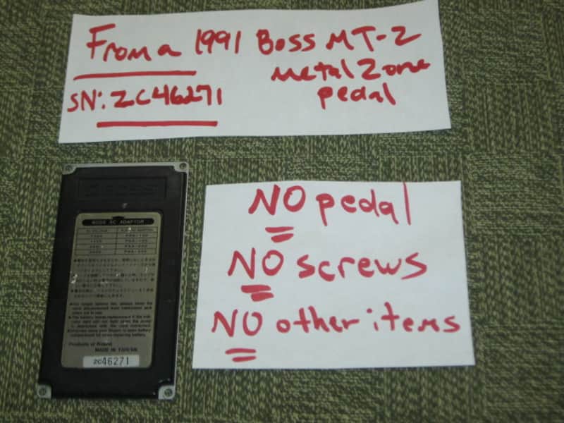 used medium relic'd genuine Boss Bottom Plate (Silver Label Taiwan) for compact (regular) size pedal, from March 1991 - PLATE PART: Metal w/ Silver Finish / BOTTOM LABEL: SLT / EXTERIOR PADDING: Black stiff hardened rubber - NO: pedal/screws/other items image 1