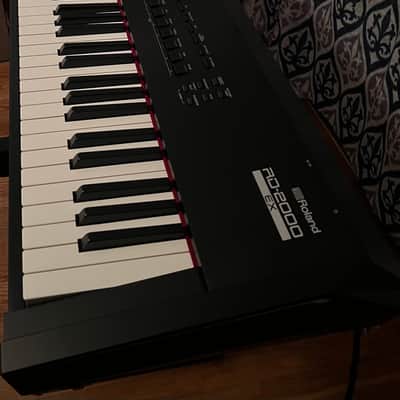 Roland 2000EX 2024 and Black Case Road Runner hard/flight case with wheels and lockable latches and  Stand: ProLine Z‑style keyboard stand included