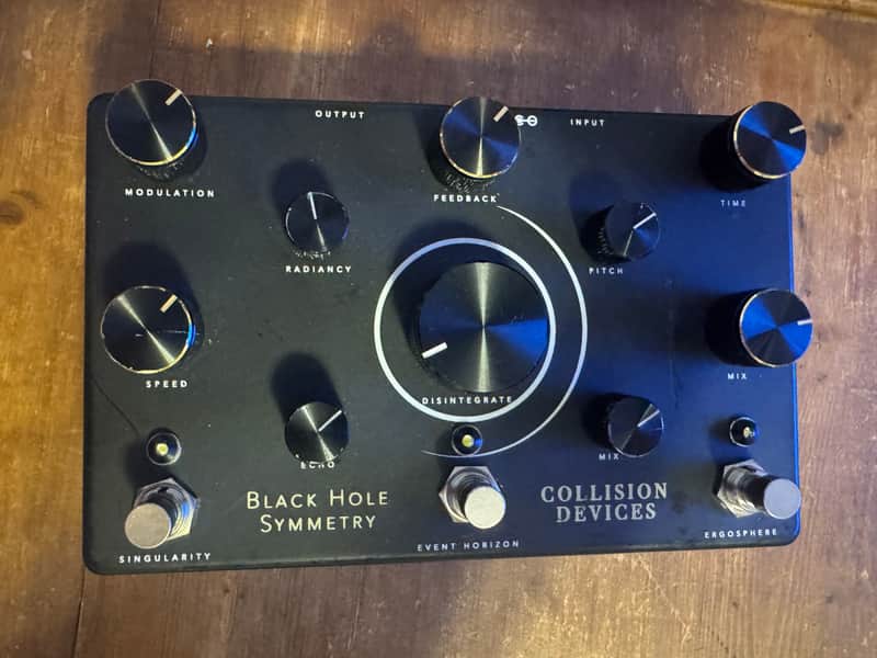 Collision Devices Black Hole Symmetry
