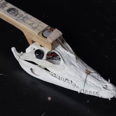Cigarbox guitar 3 string crocodile skull guitar image 1
