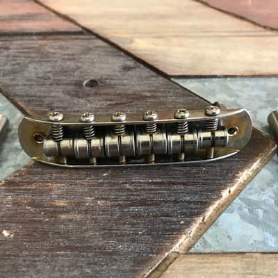 Real Life Relics Fender®  Aged Nickel Mustang® Bridge    [K9]