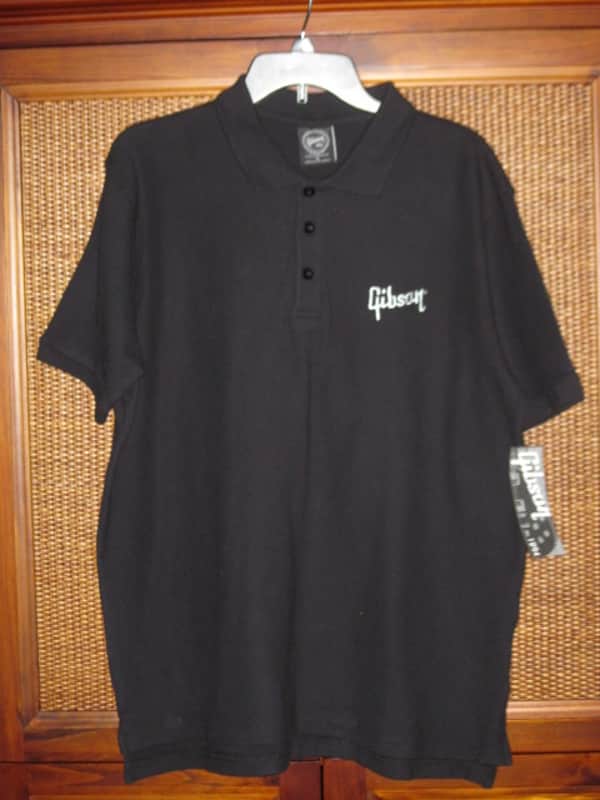 new (old stock) with hang tag (A+) genuine Gibson Black, 100% Cotton, Polo Style Short Sleeve Shirt, size M (medium) Manufacturers Item No: SGGABLMPOLOMD from the 2010s (but it is new) UPC # 711106561400 image 1