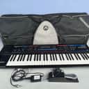 Roland Juno Di 61-Key Synthesizer + Ultimate Case + pedal