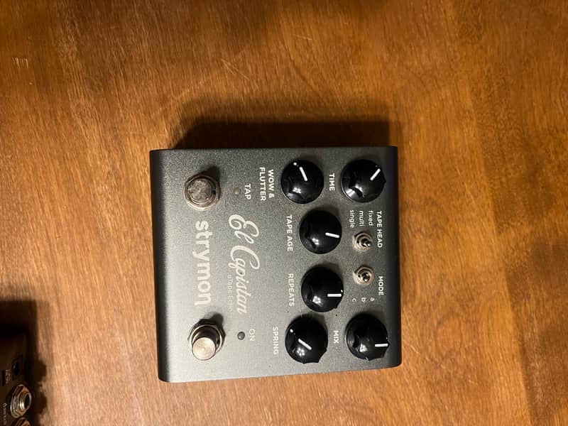 Silver stompbox with knobs and switches, labeled "El Capistan" by Strymon.