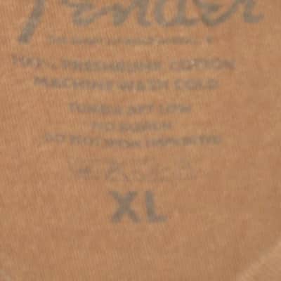 pre-owned genuine Fender Lightning Bolt Logo Short Sleeve, Cotton T-Shirt, XL, Brown (sleeves cut shorter) PN: 9101008621, from 2010, GRAPHIC: Red, Creme, Dark Brown, Fender, Ligntning Bolt, Circles, musical symbols, Electric Instrument Company Since 1946 image 4