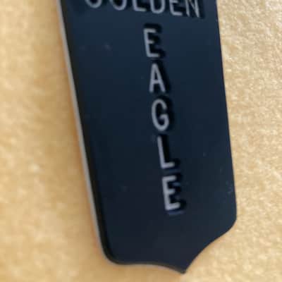 NOS-Heritage Golden Eagle Tailpiece Emblem / Shield 1985 - Black / White plastic engraved image 3