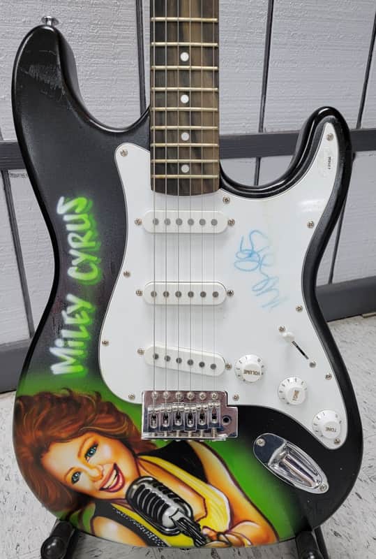 "Miley Cyrus" Autographed Guitar with "COA" image 1