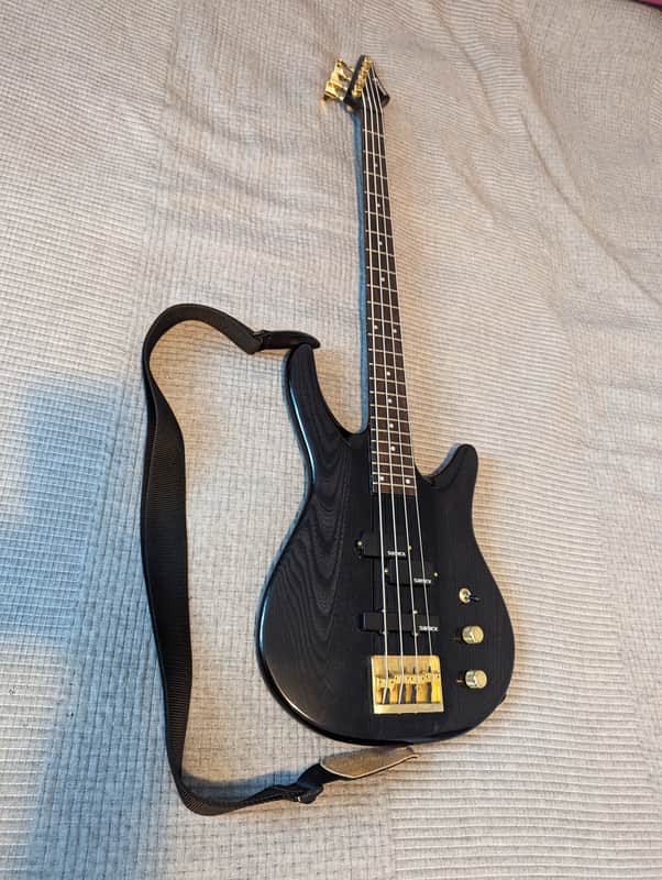 Samick One-piece bass guitar 1990s - Black Woodgrain, Brass Hardware image 1