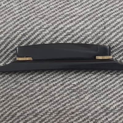 Plain Archtop Guitar Bridge -1 pc in Ebonywood with Golden wheels image 1