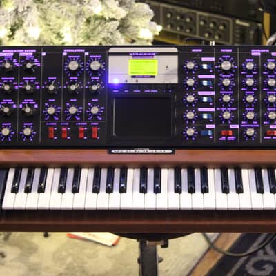 Moog Minimoog Voyager Select synthesizer with purple backlight