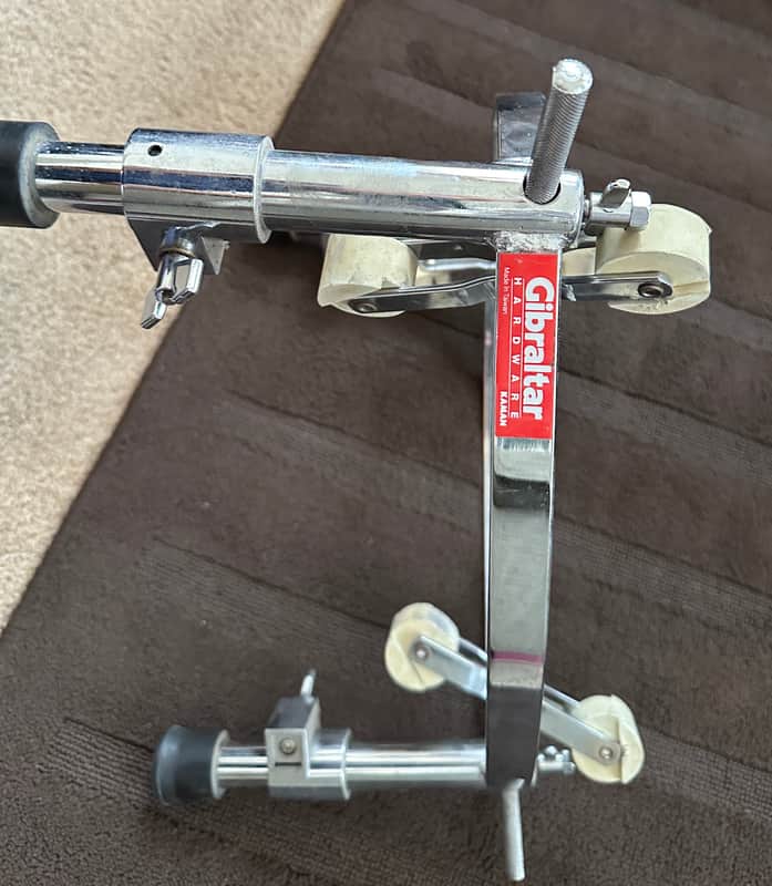 GIBRALTAR GCS-L Large Conga Stand: Heavy-duty stand with a triangular design for 11 3/4" and 12 1/2" congas. 2000 - SILVER WITH BEIGE ROLLERS image 1