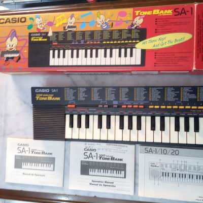 Casio SA-1 3 BOOK MANUAL 6 PATTERN PULSE CODE MODULATION PCM 100 TONE BANK 1989 - mini keyboard with complex LO-FI wavetable sounds PC Kid Techo Punk pop Japan Anime Manga Black BOXED RARE image 1