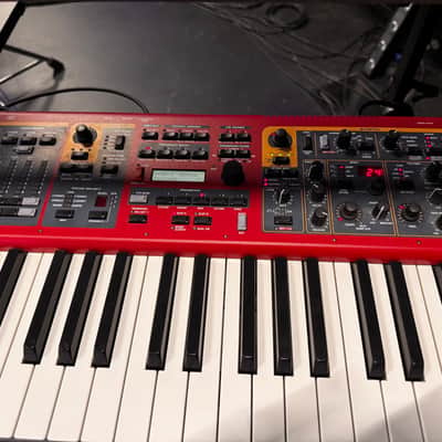 Nord Stage 2 Ex 88 2015-2017 - signature red painted chassis paired with distinct, exposed wooden side panels (cheeks) that give it a premium, classic-meets-modern aesthetic. image 3