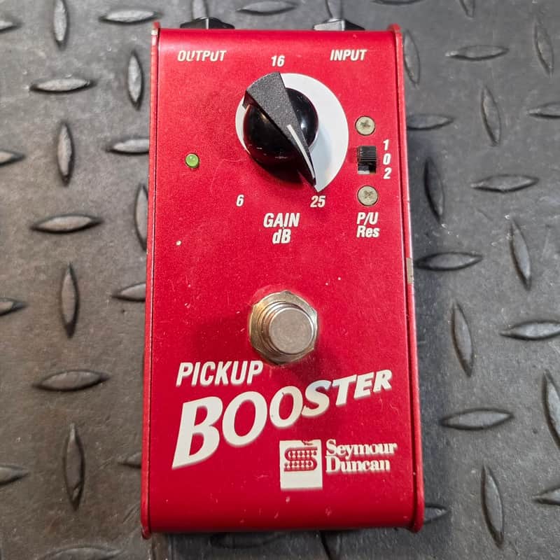 Maroon guitar effects pedal with silver knobs and text.
