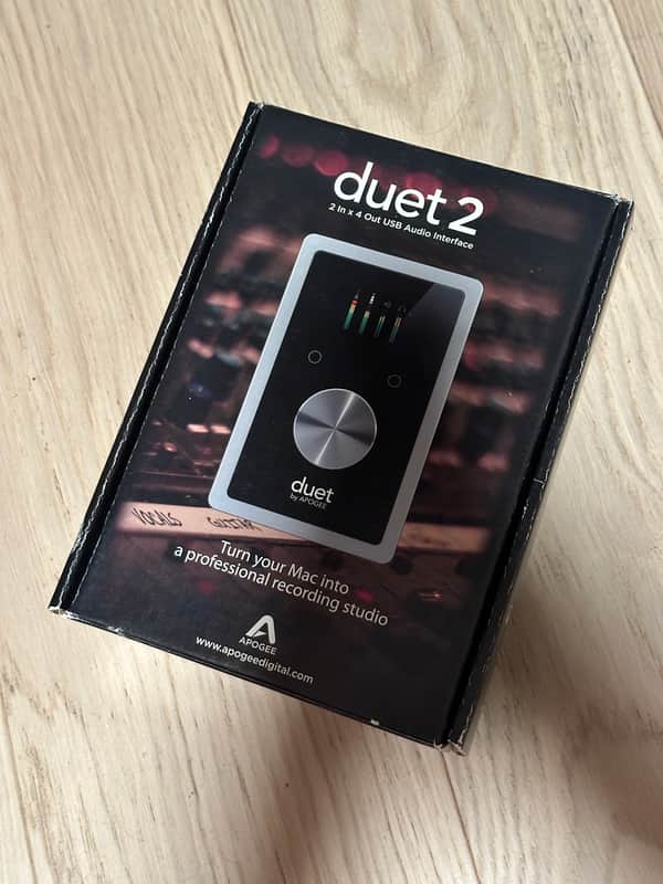 Black and silver electronic device with a circular silver button.