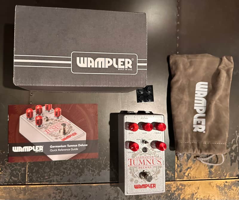 Silver and red Wampler Tumnus Deluxe guitar effects pedal.