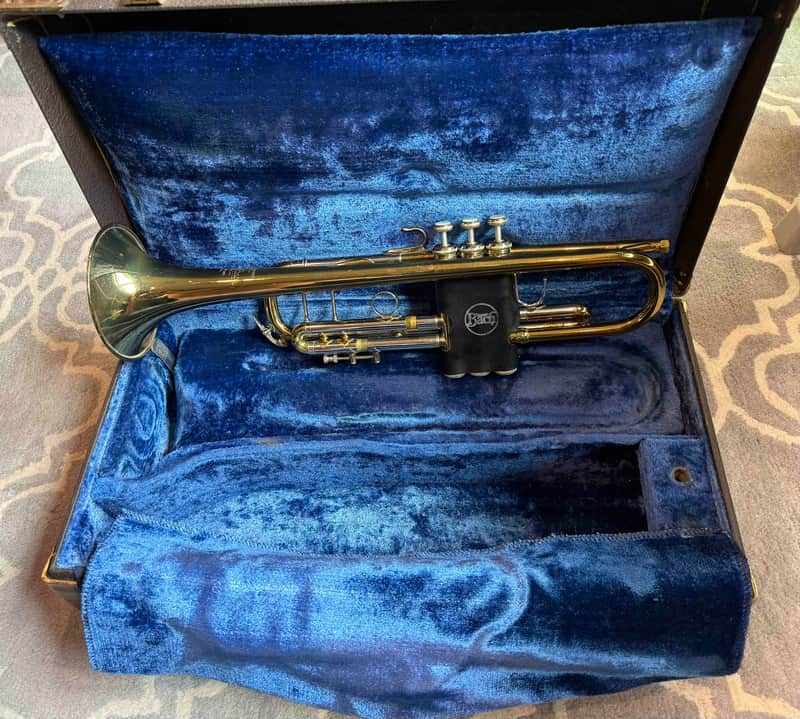 Silver trumpet, polished brass, showing some minor signs of use.